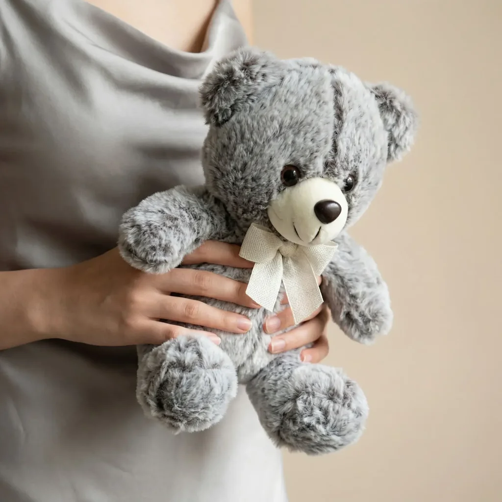 Plush toy "Teddy Bear" grey with a bow