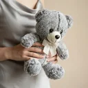 Plush toy "Teddy Bear" grey with a bow